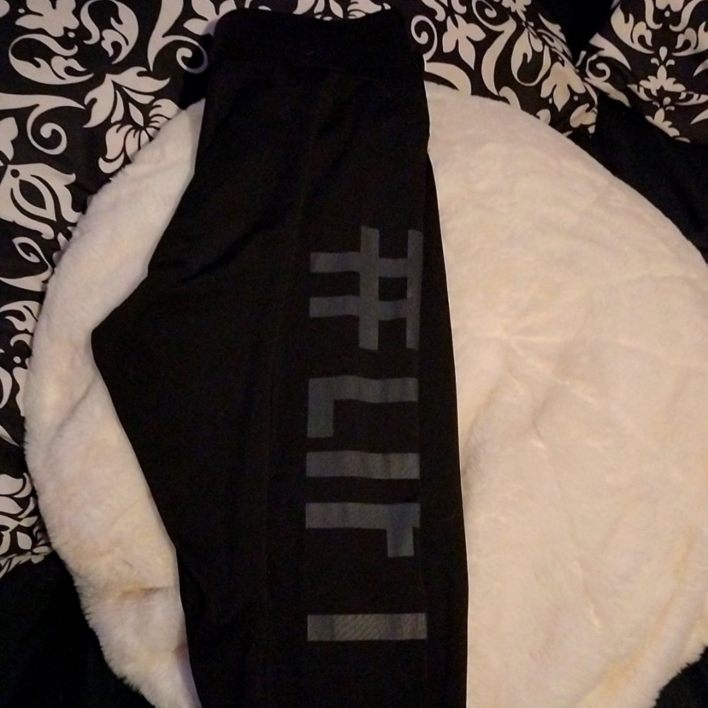 I am selling a pair of leggings. On one side it says "Lift # Squat".
